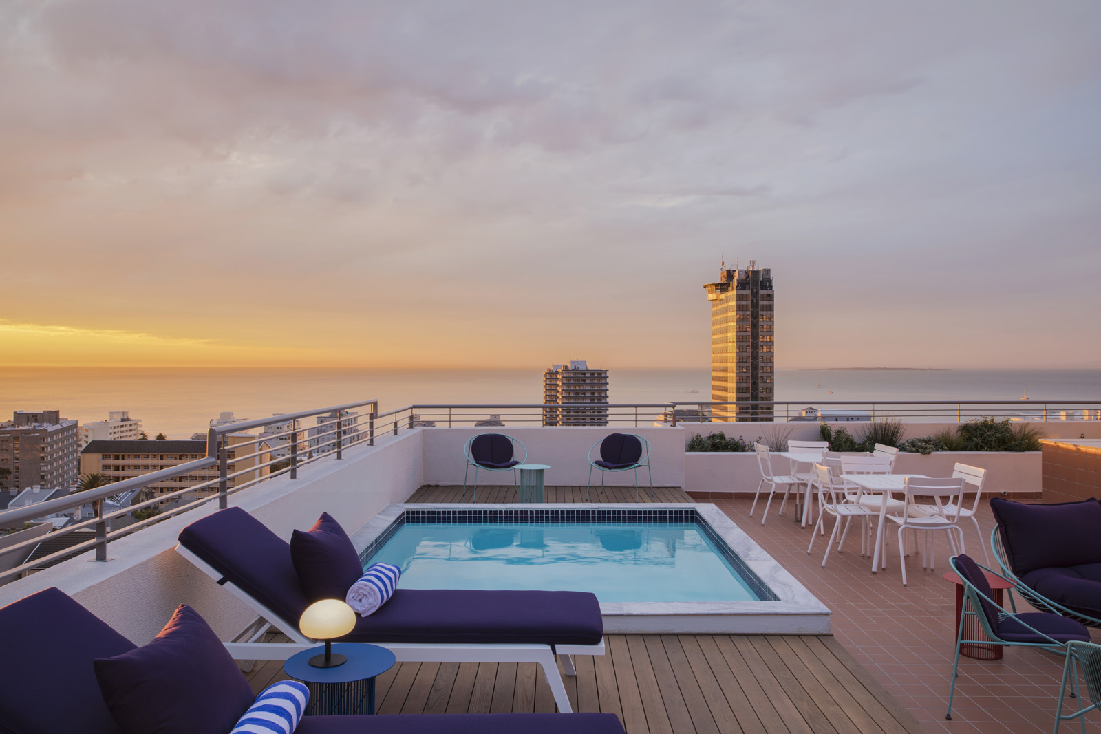 Rooftop pool at Home Suite Hotels Sea Point overlooking the Atlantic Ocean at sunset